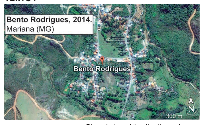 Imagem de satélite de Bento Rodrigues, Mariana (MG), em 2014, com o povoado entre áreas verdes e estradas de terra.