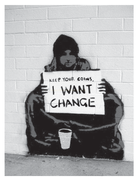 Arte urbana em estêncil sobre parede de tijolos, mostrando pessoa encapuzada sentada segurando um cartaz com o texto 'KEEP YOUR COINS, I WANT CHANGE' e um copo no chão.